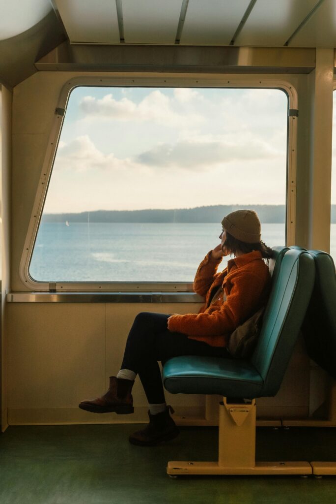 A person reflecting on life and societal norms while staring out at the sea