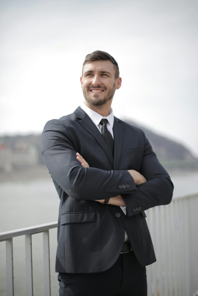 “A young person standing confidently in formal attire, symbolizing the illusion of glorified careers and societal pressure in choosing paths.”