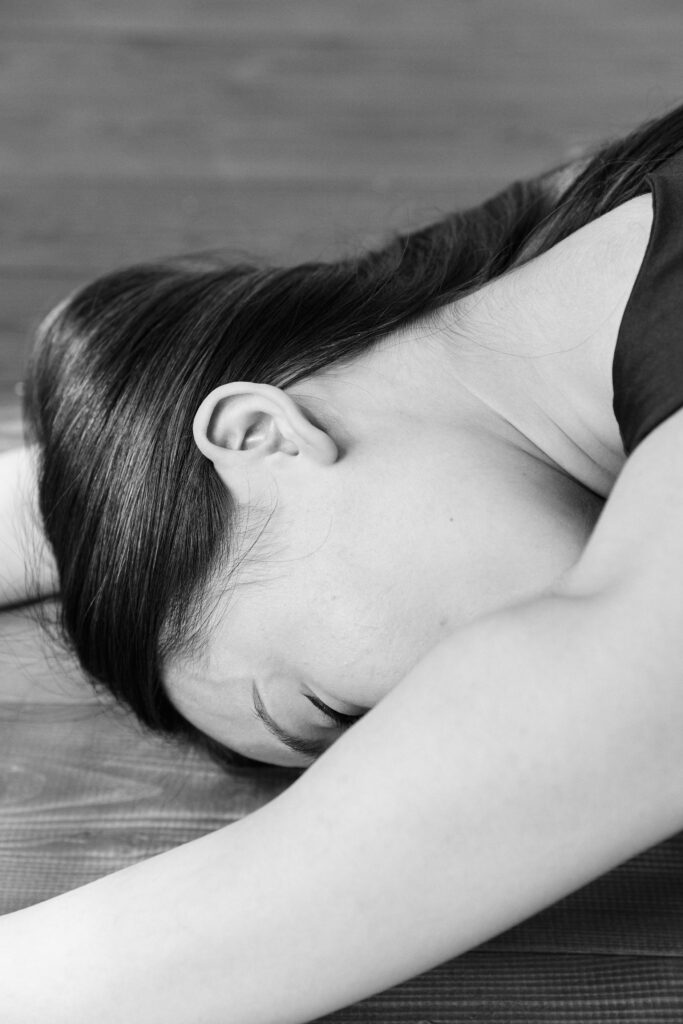 A woman collapsed on the floor, representing the urgency of learning basic life-saving skills.
